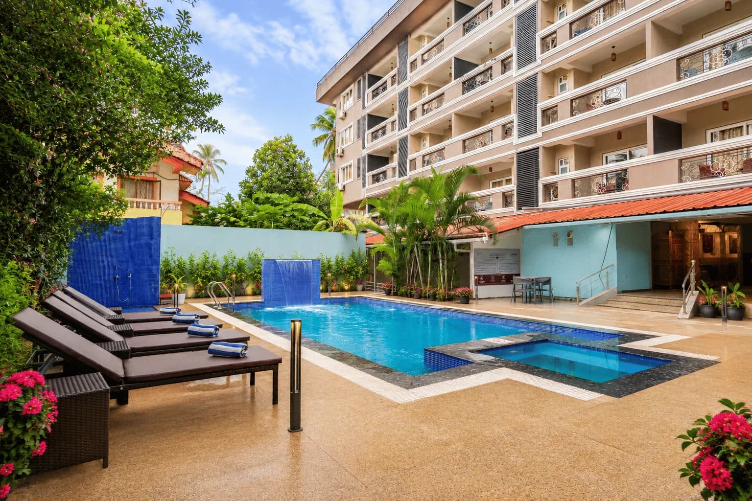 Resort pool and sun loungers during the day